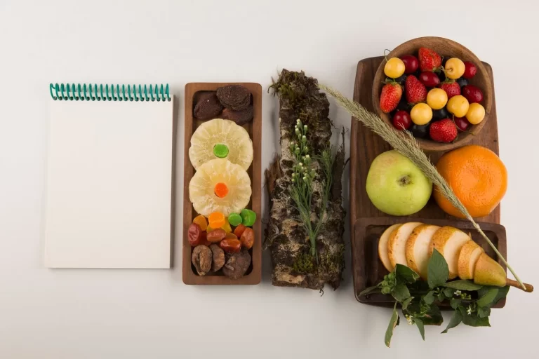 berries-fruit-mix-herbs-wooden-platter-with-notebook-aside_114579-12840