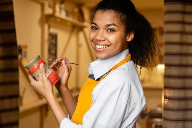 smiley-woman-holding-clay-pot_23-2148944974